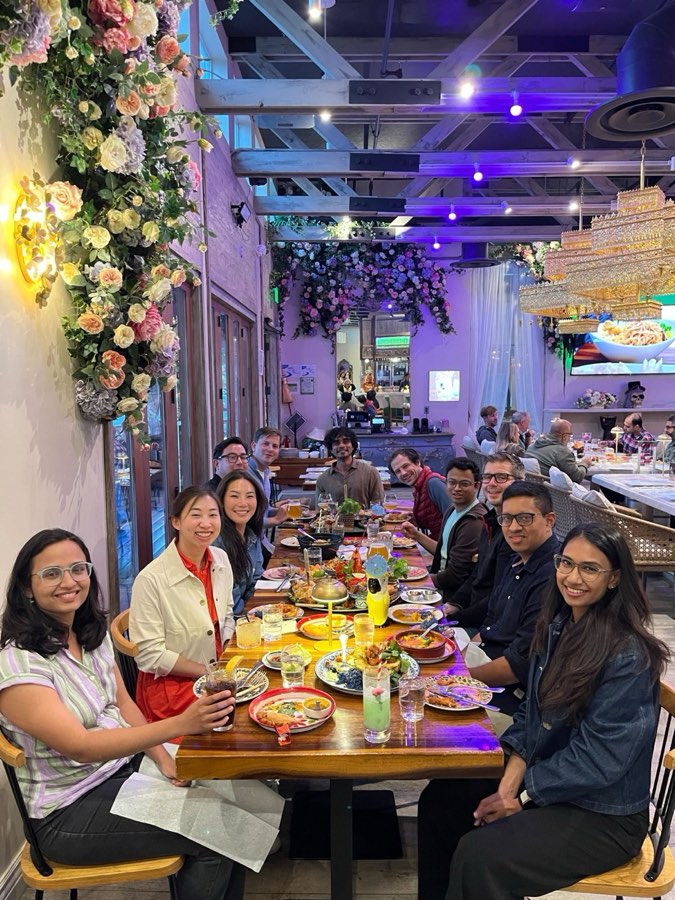 Team dinner at a restaurant decorated with flowers