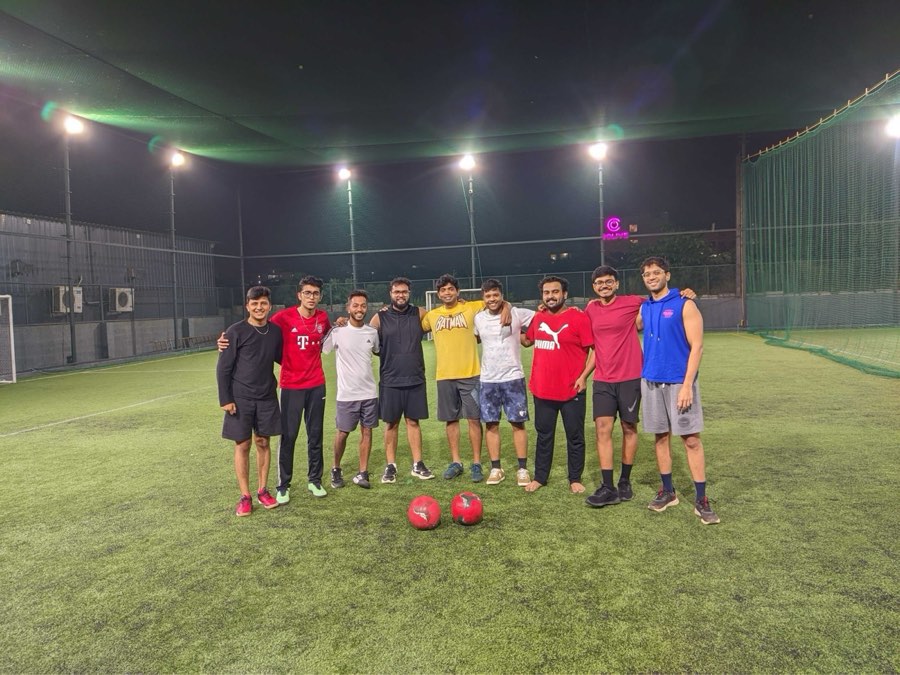 The Bangalore team on a floodlit five-a-side pitch